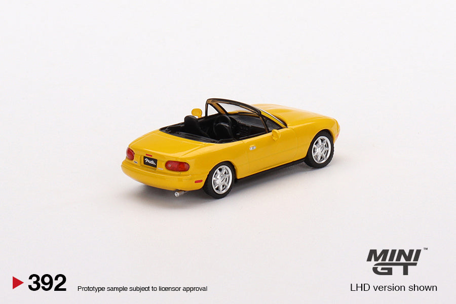 Mô hình xe Mini GT 1:64 Mazda Miata MX-5 (NA) Sunburst Yellow - MGT00392