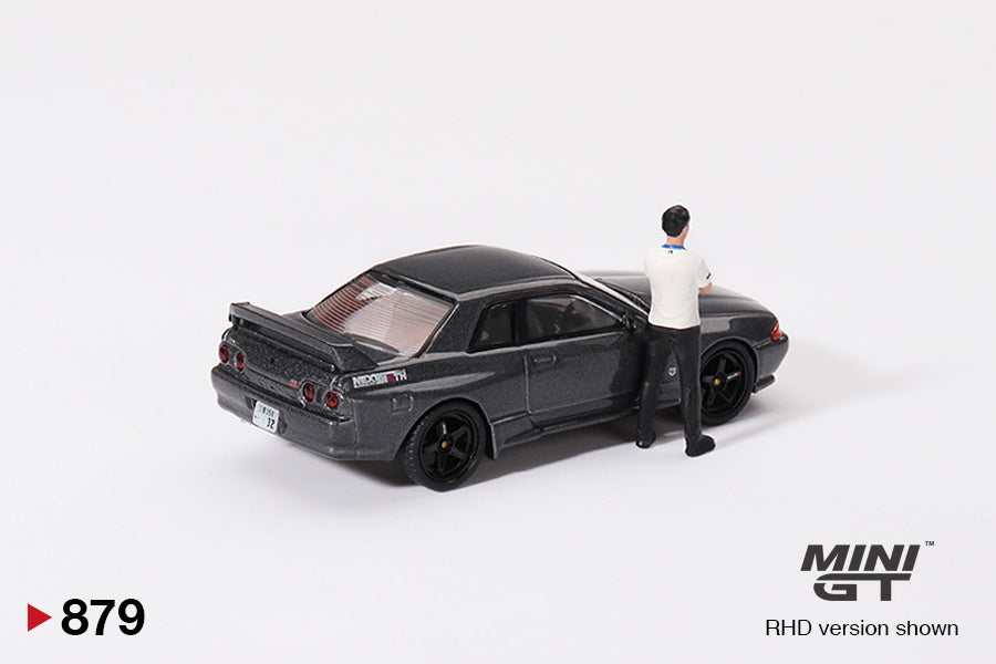 Mô hình xe Mini GT 1:64 Nissan Skyline GT-R (R32) Gunmetal W/ Matsuda Figure Tsugio Matsuda Collection No.3 TAS 2025 Exclusive - MGT00879