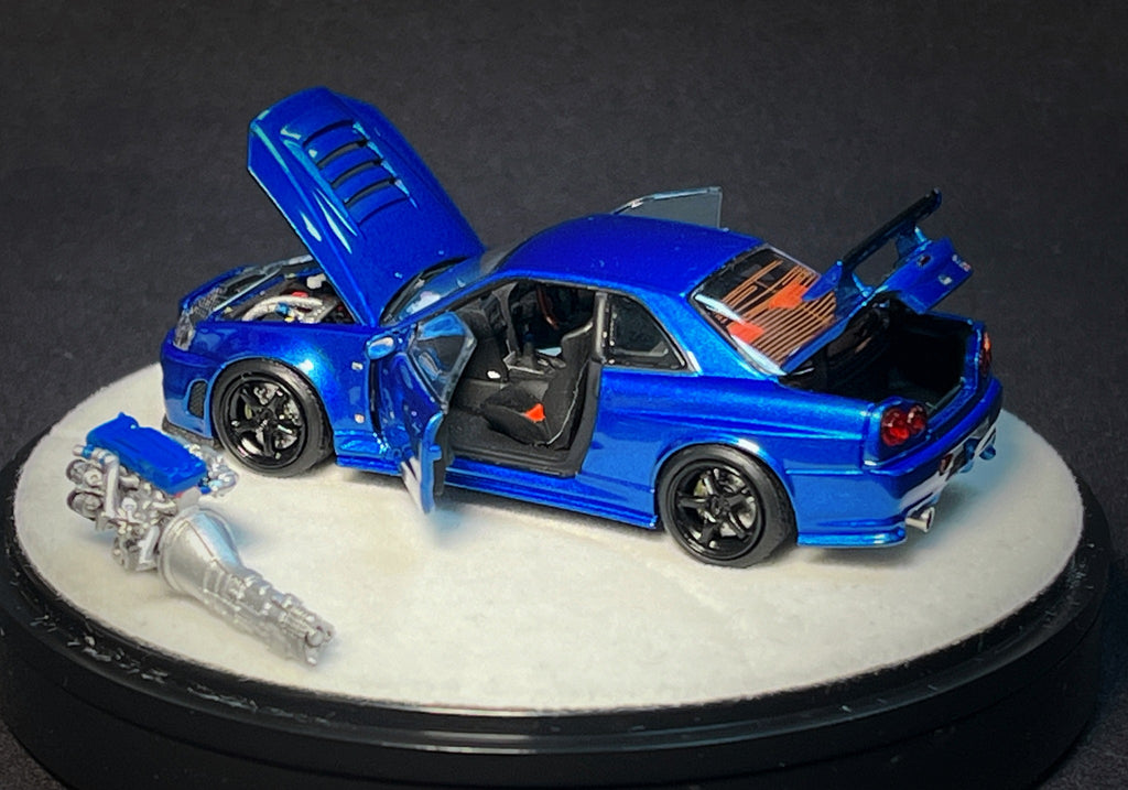 Mô hình xe PGM 1:64 Nissan Skyline GT-R (R34) in Bayside Blue Luxury Version / PGM-641002B