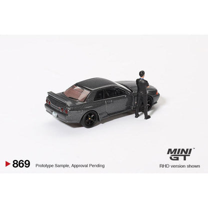 [HÀNG CÓ SẴN] Mocus Mô hình xe Mini GT 1:64 Nissan Skyline GT-R (R32) Nismo Gunmetal W/ Matsuda Figure 869