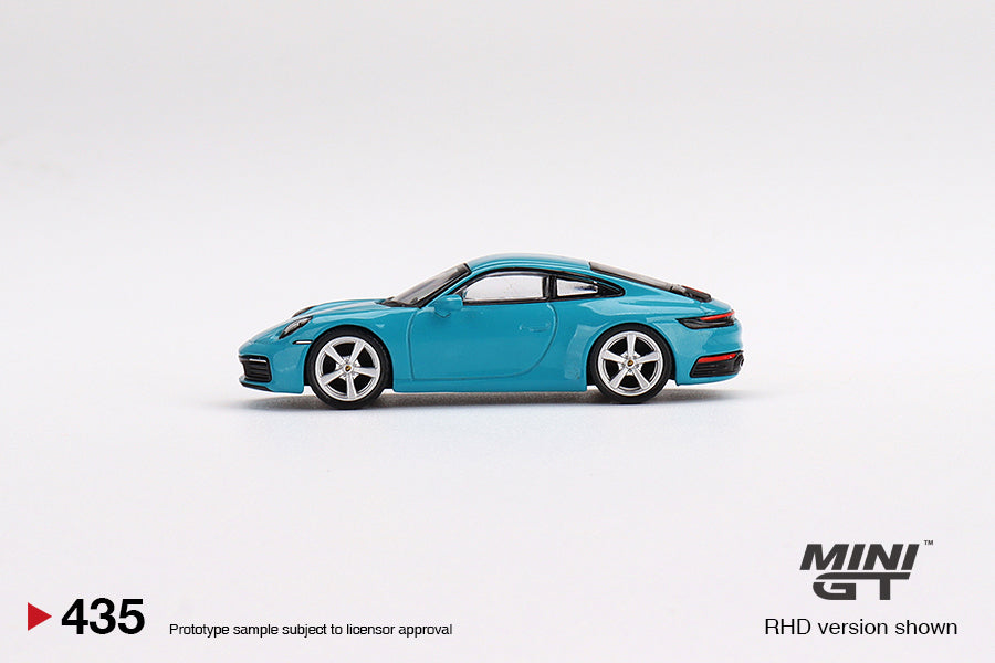 Mô hình xe Mini GT 1:64 Porsche 911 (992) Carrera S Miami Blue - MGT00435
