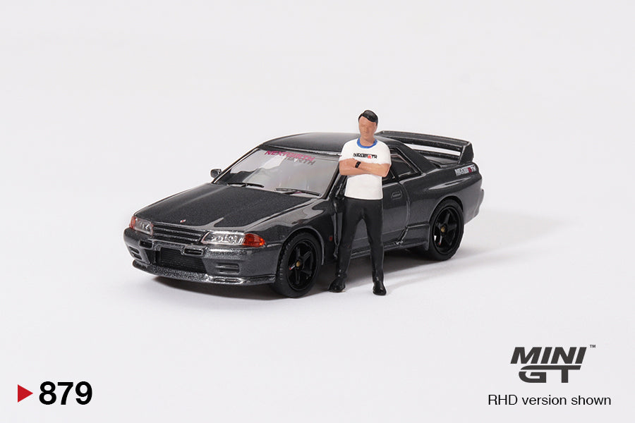 Mô hình xe Mini GT 1:64 Nissan Skyline GT-R (R32) Gunmetal W/ Matsuda Figure Tsugio Matsuda Collection No.3 TAS 2025 Exclusive - MGT00879