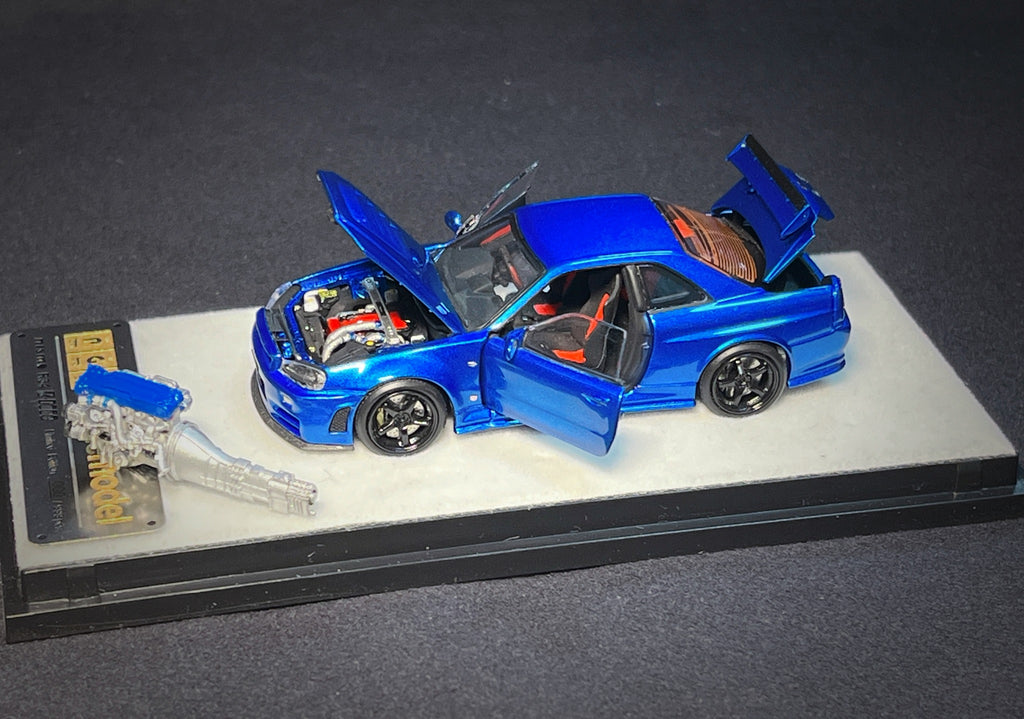 Mô hình xe PGM 1:64 Nissan Skyline GT-R (R34) in Bayside Blue Regular Version / PGM-641002A