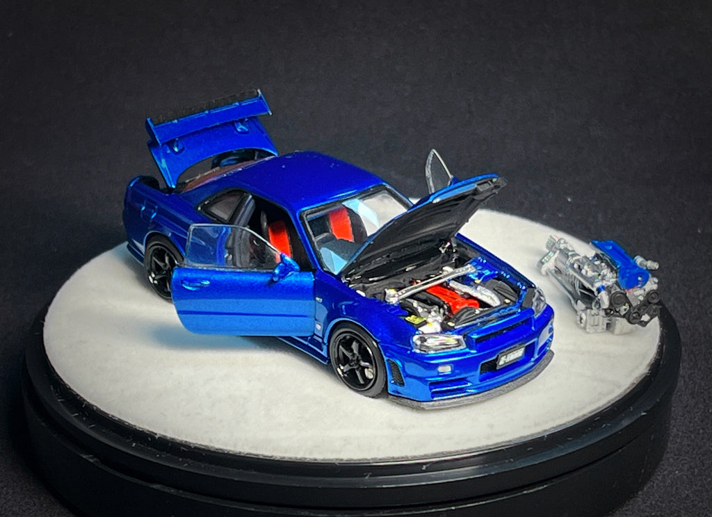Mô hình xe PGM 1:64 Nissan Skyline GT-R (R34) in Bayside Blue Luxury Version / PGM-641002B