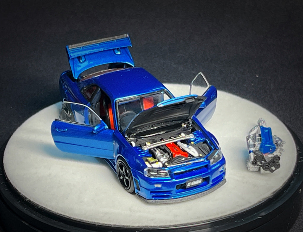 Mô hình xe PGM 1:64 Nissan Skyline GT-R (R34) in Bayside Blue Luxury Version / PGM-641002B