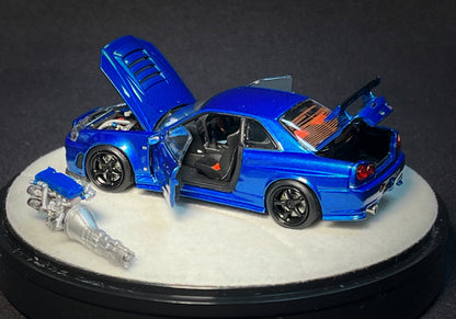 Mô hình xe PGM 1:64 Nissan Skyline GT-R (R34) in Bayside Blue Luxury Version / PGM-641002B
